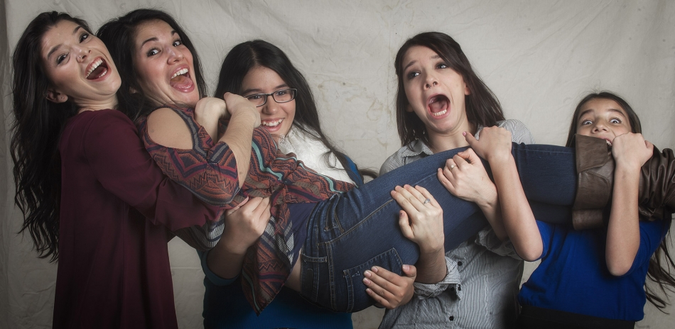 Cousins Olivia, left, Enedina, Julia, Aundrea, and Anna have some fun during a photo shoot at the Ericksen's home during Thanksgiving. Photo by Mike Sweeney/©2013